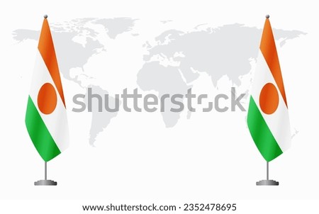 Niger and Niger flags for official meeting against background of world map.