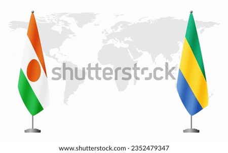 Niger and Gabon flags for official meeting against background of world map.