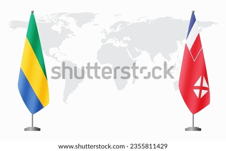 Gabon and Wallis and Futuna flags for official meeting against background of world map.