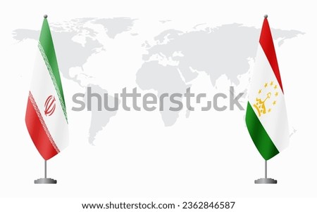 Iran and Tajikistan flags for official meeting against background of world map.