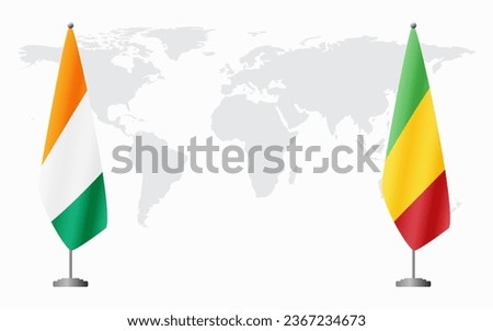 Ivory Coast and Mali flags for official meeting against background of world map.