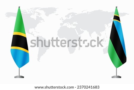 Tanzania and Zanzibar flags for official meeting against background of world map.