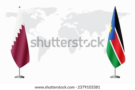  Qatar and South Sudan flags for official meeting against background of world map.