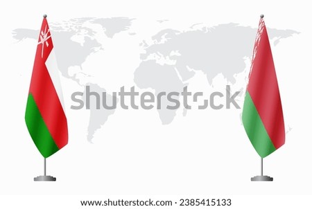 Oman and Belarusian flags for official meeting against background of world map.