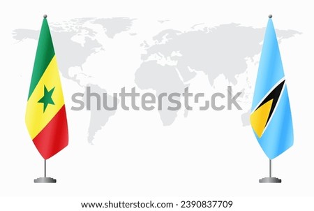 Senegal and Saint Lucia flags for official meeting against background of world map.