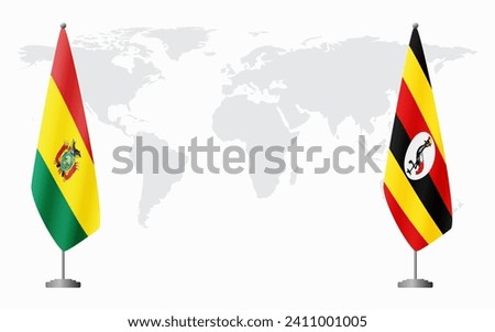 Bolivia and Uganda flags for official meeting against background of world map.