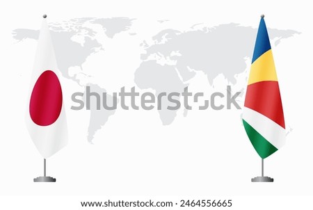 Japan and Seychelles flags for official meeting against background of world map.