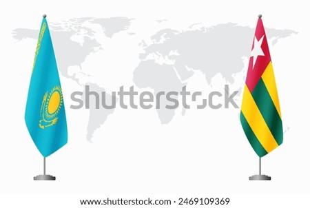 Kazakhstan and Togo flags for official meeting against background of world map.