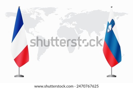 France and Slovenia flags for official meeting against background of world map.