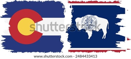 Wyoming and Colorado states grunge brush flags connection, vector