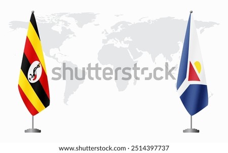 Uganda and Saint Martin flags for official meeting against background of world map.