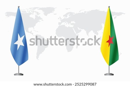 Somalia and French Guiana flags for official meeting against background of world map.