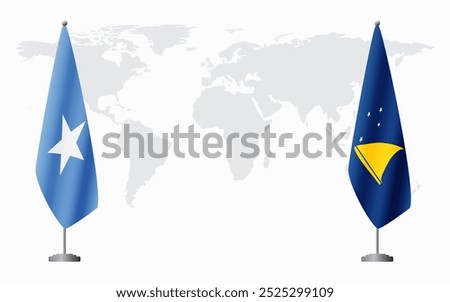 Somalia and Tokelau flags for official meeting against background of world map.