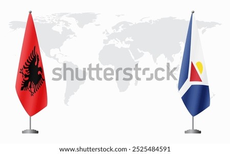 Albania and Saint Martin flags for official meeting against background of world map.