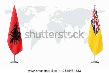 Albania and Niue flags for official meeting against background of world map.