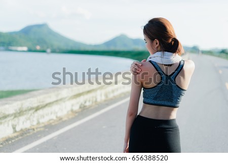 https://image.shutterstock.com/display_pic_with_logo/4078237/656388520/stock-photo-young-girl-asian-shoulder-pain-after-exercise-running-and-walking-workout-street-outdoor-at-656388520.jpg