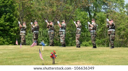 ANN ARBOR, MI - MAY 27: Members of the military fire a salute at the annual Memorial Day observance on May 27, 2012 at Arborcrest Memorial Park in Ann Arbor, MI