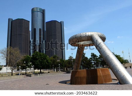 DETROIT, MI - JULY 6: The Renaissance Center, shown here behind Hart Plaza in downtown Detroit on July 6, 2014, houses the world headquarters of General Motors.
