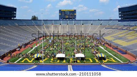ANN ARBOR, MI - AUGUST 10:  Visitors meet players and others at Michigan stadium during Michigan Football Youth Day on August 10, 2014 in Ann Arbor, MI.