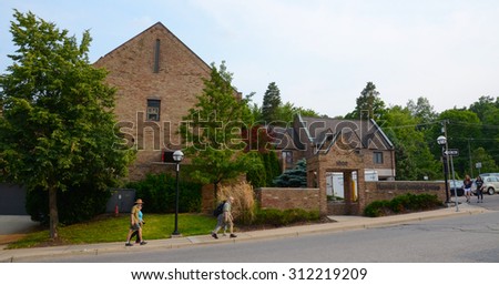ANN ARBOR, MI - JUNE 9:  People walk past the Ronald McDonald House in Ann Arbor on June 9, 2015. Ronald McDonald Houses serve families with hospitalized children.