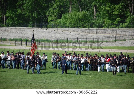DEARBORN, MI - MAY 30: A line of soldiers advances during an American Civil War battle reenactment May 30, 2011 at Greenfield Villa, Dearborn, MI