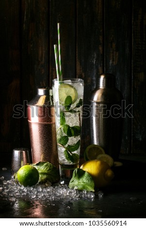 Similar – Foto Bild Zwei Mojito-Cocktails mit gealtertem Rum, Minze und verschiedenen Früchten. Einer mit Erdbeere und der andere mit Passionsfrucht