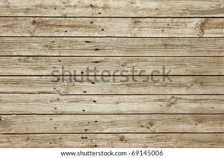 Perfectly lit wooden background with weathered wood and ruusty nails