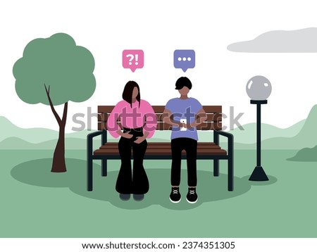 A guy with dark skin, dark hair of Caucasian appearance in fashionable clothes is sitting in a smartphone in the park on a bench next to a tree and a lantern with his girlfriend