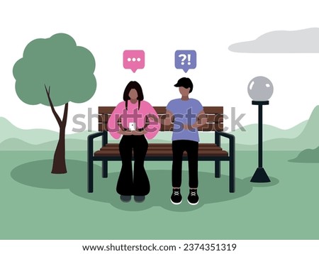A girl with dark skin, dark hair of Caucasian appearance in fashionable clothes is sitting in a smartphone in a park on a bench next to a tree and a lantern