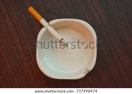 Similar – Image, Stock Photo Ashtray with cigarettes