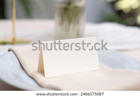 Similar – Image, Stock Photo Wedding Table place with a card over envelope near flowers and feathers, mockup