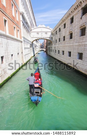 Similar – Image, Stock Photo Gondolas sailing along canal between city buildings