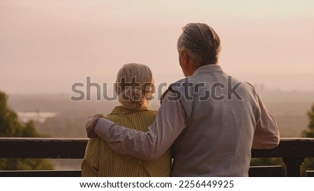 Similar – Image, Stock Photo Senior lady admiring sunset over ocean from boardwalk