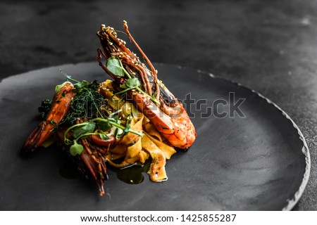 food fish elegant gourmet black plate top view lunch dinnerdish meal fine dining closeup green sea seafood shrimp beautiful modern Stock foto © 