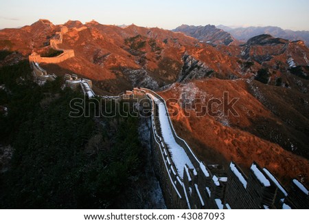 The Great Wall in winter. Red color in the sunshine.