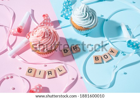 gender party. boy or girl. two cupcakes with blue and pink cream, celebration concept when the gender of the child becomes known Foto stock © 