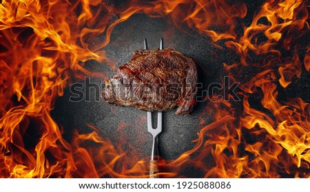 grilled marbled beef steak and fire