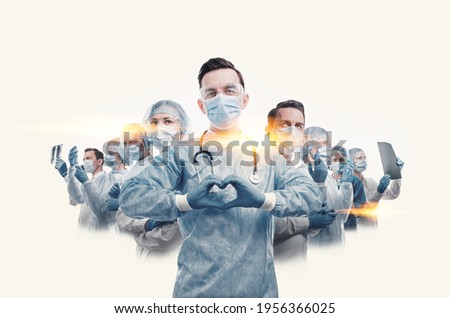medical workers heroes. a nurse in the foreground in a mask and uniform holds her hands in the shape of a heart. go to a lot of medical professionals.