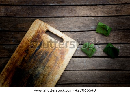 Thai Dessert Form Banana Leave On Black Wooden Background - 