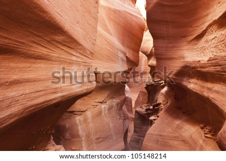 The rock walls form a wave texture in Peek-a-Boo Slot Canyon in Escalante National Monument, Utah
