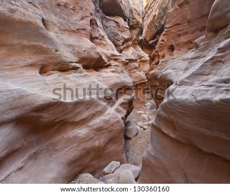 Eroded rock 'faces' face-off in Little Wild Horse Slot Canyon near Goblin Valley State Park in Utah