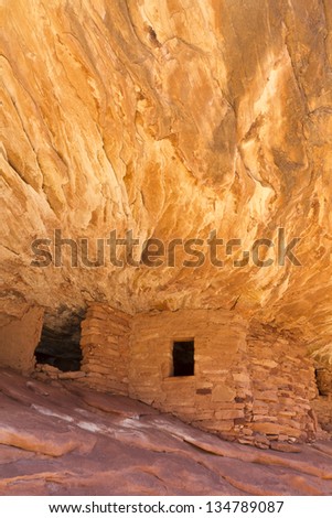 The 'House on Fire' Puebloan ruins in Mule Canyon in the Cedar Mesa Plateau of Utah look like the ancient stone granaries and dwellings are on fire.