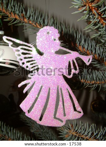 glowing christmas tree angel playing flute