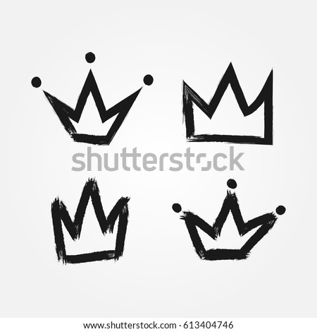 Set of silhouettes of crowns. Painted by hand with a rough brush. Isolated black icons. Grunge. Vector illustration. 