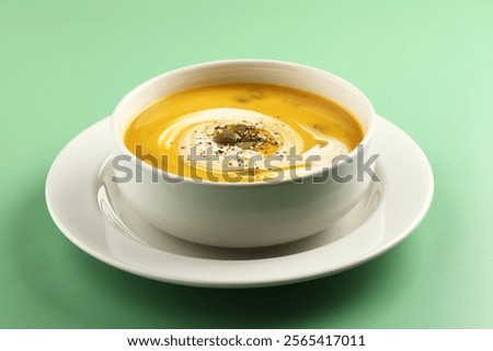 Similar – Image, Stock Photo Pumpkin creamy soup served on green leaf