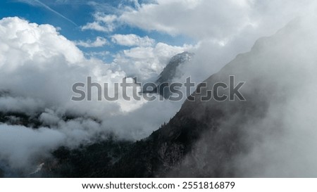 Similar – Foto Bild Schroffer Berggipfel eingehüllt in dunkle Wolken