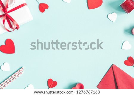Valentine's Day background. Gifts, candle, confetti, envelope on pastel blue background. Valentines day concept. Flat lay, top view, copy space Foto stock © 
