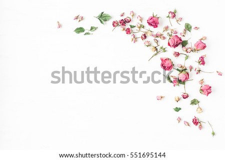 Photo of Flowers composition. Frame made of dried rose flowers on white background. Flat lay, top view, copy space