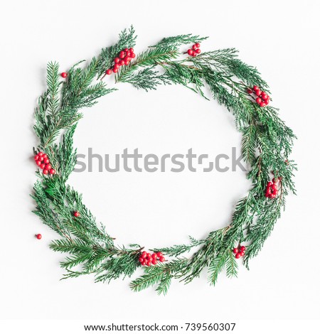 Image, Stock Photo Christmas composition. Wreath made of fir tree branches and festive pine cones on a red background, top view