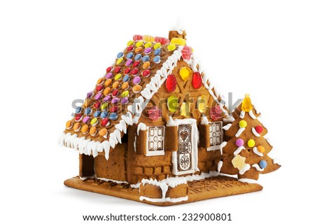 Colorful gingerbread house isolated against white background